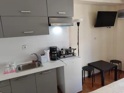 a kitchen with a sink and a counter top at PURE URBAN PREMIUM METRO AGIOS NIKOLAOS in Athens