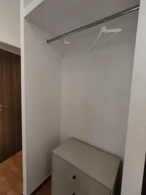 a closet with a dresser in a room at PURE URBAN PREMIUM METRO AGIOS NIKOLAOS in Athens