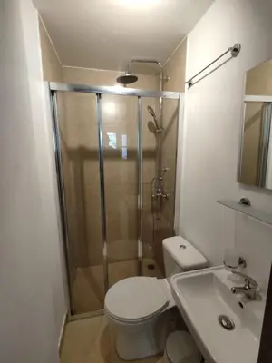 a bathroom with a shower and a toilet and a sink at PURE URBAN PREMIUM METRO AGIOS NIKOLAOS in Athens