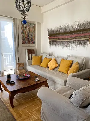 a living room with a couch and a coffee table at Nest in Mets in Athens