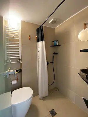a bathroom with a toilet and a shower at Nest in Mets in Athens