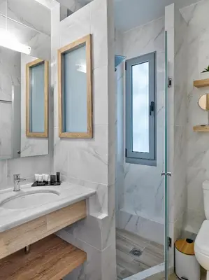 a bathroom with a sink and a shower at Acropolis City Life BH in Athens