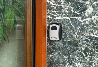 a door handle with a phone sign on a wall at Modern studio Chiou in Athens