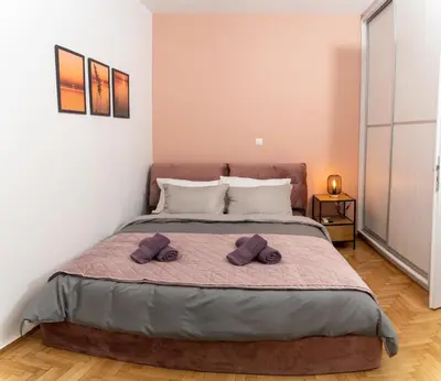 a bedroom with a bed with two towels on it at Modern studio Chiou in Athens