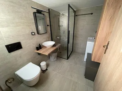 a bathroom with a toilet and a sink and a shower at PSH -Stylish Quiet Top Floor Apt- Near Acropolis in Athens