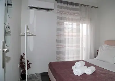 a bedroom with a bed with two towels on it at Monastiraki Sweet House 2 in Athens