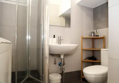 a bathroom with a shower and a toilet and a sink at Monastiraki Sweet House 2 in Athens