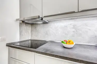 a bowl of vegetables on a counter in a kitchen at EvZin Homes Athens NEa Smyrni in Athens