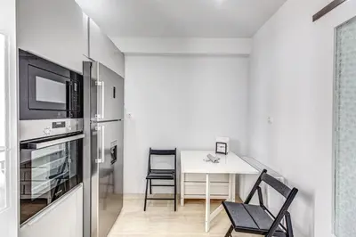 a kitchen and dining room with a table and chairs at EvZin Homes Athens NEa Smyrni in Athens