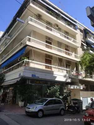 a car parked in front of a building at LG apartment bnb in Athens