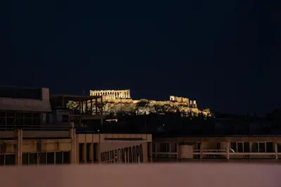 a view of the acropolis at night at Private Jacuzzi & Acropolis View - The Suite in Athens