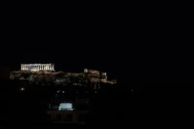 a night view of the acropolis of athens at Private Jacuzzi & Acropolis View - The Urban Loft in Athens