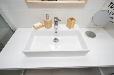 a white sink in a bathroom with a mirror at Evaggelismos m station studio for 3 pers by MPS in Athens