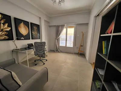 a home office with a desk and a chair at Maria's Maisonette in Athens