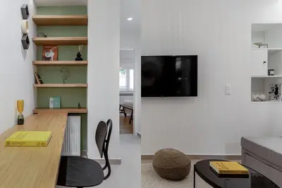 two views of a living room and a living room with a tv at Dreamy 1BR Apartment in Kolonaki by UPSTREET in Athens