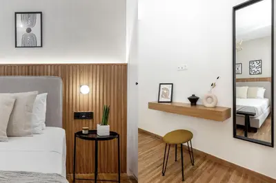 a bedroom with a bed and a mirror at Dreamy 1BR Apartment in Kolonaki by UPSTREET in Athens