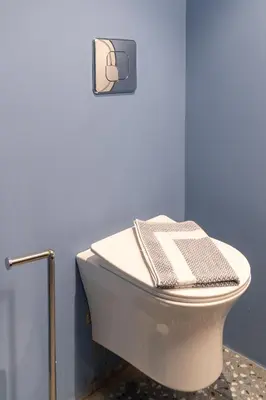 a bathroom with a toilet with a towel on it at Syntagma Sweet House 3 in Athens