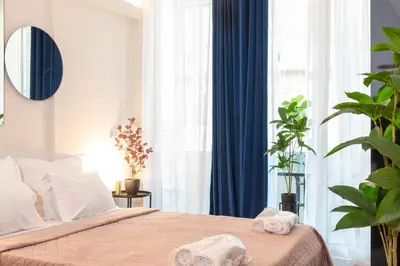 a bedroom with a bed with towels on it at Syntagma Sweet House 3 in Athens
