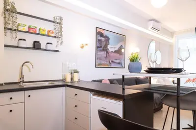 a kitchen with a sink and a counter top at Syntagma Sweet House 4 in Athens