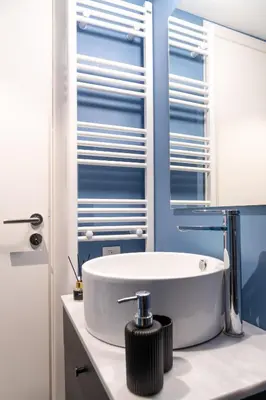 a bathroom with a white sink and a mirror at Syntagma Sweet House 4 in Athens