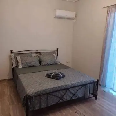 a bedroom with a bed in a room at Glyfada-Elliniko in Athens