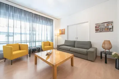 a living room with a couch and chairs and a table at Noho apartments x Koukaki dikaiou 6 in Athens
