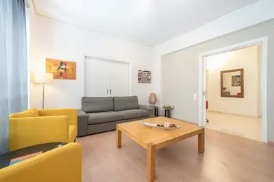a living room with a couch and a coffee table at Noho apartments x Koukaki dikaiou 6 in Athens