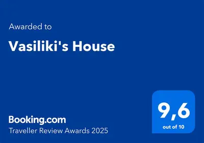 a blue sign that says vashikikis house at Vasiliki's House in Porto Rafti