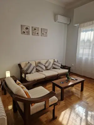 a living room with a couch and a coffee table at EstellApartments in Athens