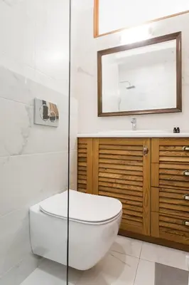 a bathroom with a toilet and a sink and a mirror at Neat Kolonaki Apartment, Athens City Centre - NV8 in Athens