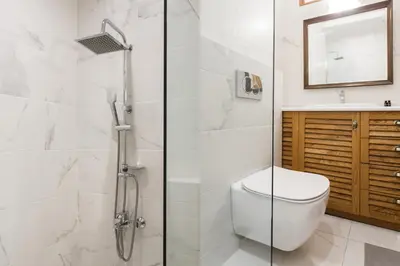 a bathroom with a shower and a toilet and a sink at Neat Kolonaki Apartment, Athens City Centre - NV8 in Athens