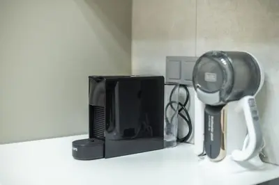 a counter top with a microwave and a television at Panathenaic Stadium By Greece Apartments in Athens