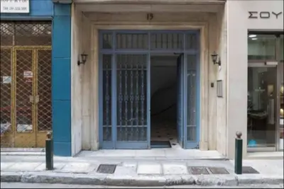 an entrance to a building with a blue door at The Owl nest Modern and Cozy place in the Historical Center in Athens