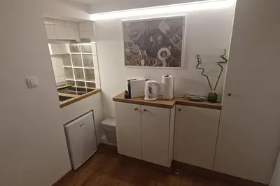 a small kitchen with a sink and a toilet at The Owl nest Modern and Cozy place in the Historical Center in Athens
