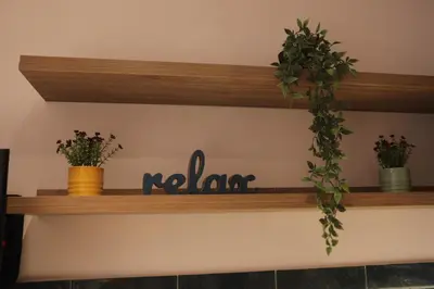 a shelf with plants and a sign that reads noah at IPELHOME-Avissinias Boutique Apartments in Athens