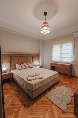 a bedroom with a large bed and a window at Sweet Dreams 2 Bedroom VIPGreece in Athens