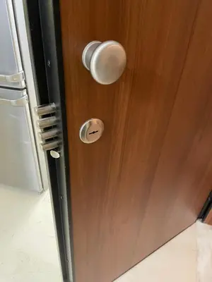 a wooden door with a white door knob and a door at acropolis super cosy apartment in Athens