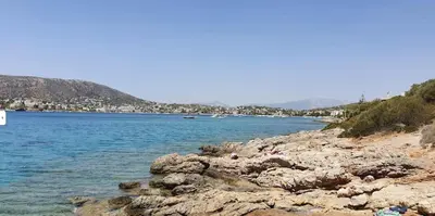 a group of people on the shore of a body of water at Porto sea view house - 15min from Athens airport - AC - WIFI - PARKING in Porto Rafti