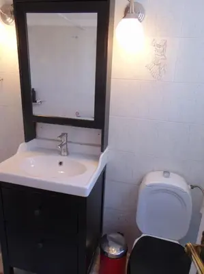 a bathroom with a sink and a toilet at Lovingly restored apartment Galatsi in Athens
