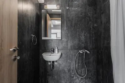 a bathroom with a sink and a shower at Loft in Psirri by Liberty's Canvas in Athens