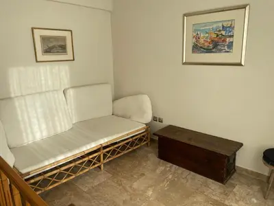 a small room with a chair and a table at Athens Neos Kosmos penthouse, sea and city view in Athens