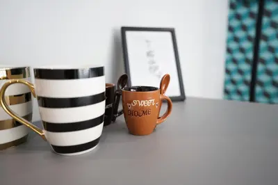 two coffee mugs sitting on a table at Athens City Living at Akadimias in Athens