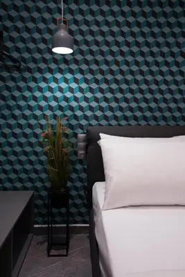 a bedroom with a white bed and a blue wall at Athens City Living at Akadimias in Athens