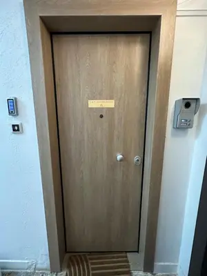 a wooden door with a sign on it at G&W Luxury Rooms in Athens