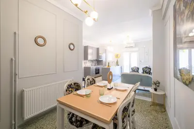 a kitchen and dining room with a table and chairs at Luxury Penthouse in prime central Athens Thissio by GHH in Athens