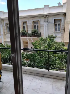 a view of a building from a window at AcropolisCozyStay in Athens