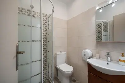 a bathroom with a toilet and a sink at Victoria Boutique Studios in Athens