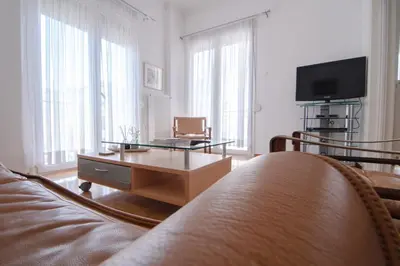 a living room with a couch and a coffee table at The Rebel's Temple in Athens