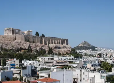 a view of the acropolis from the city of athens at The Rebel's Temple in Athens