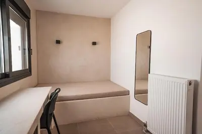 a small room with a bench and a window at Suites with magical view & jacuzzi in Athens